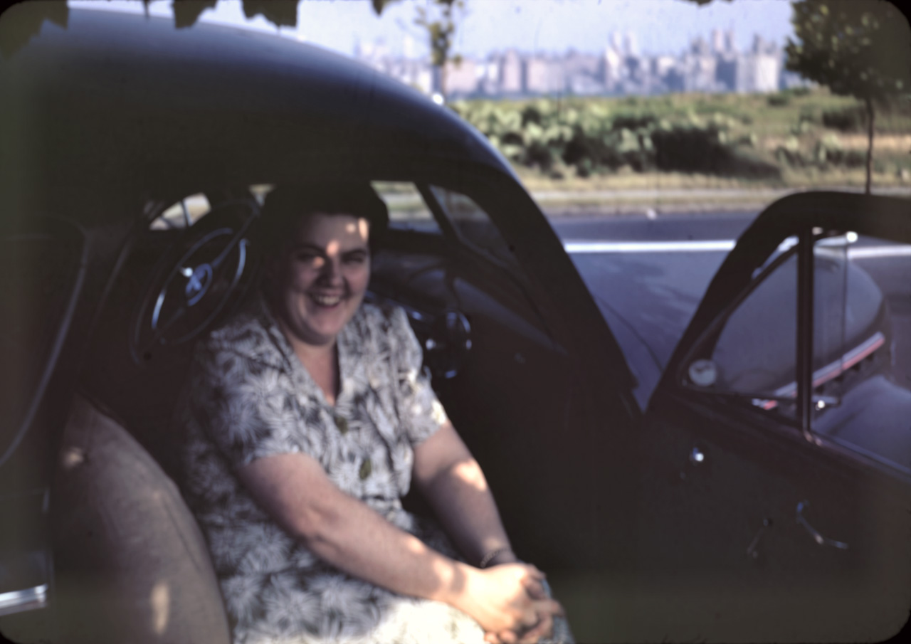 42-07-05, 02, Blanche Bruno sitting in car